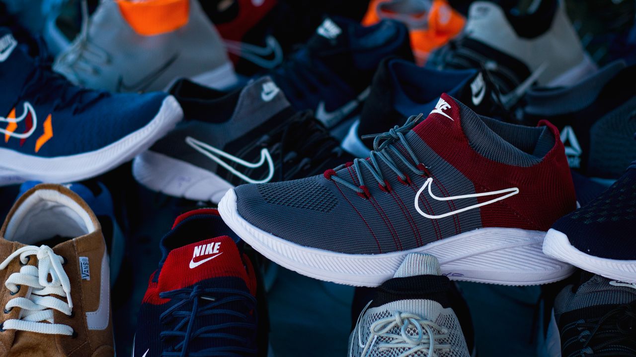 about-us Diverse array of athletic shoes showcased in vibrant colors and various styles.